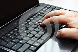 Typing on a laptop computer