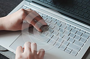 Typing on the laptop keyboard