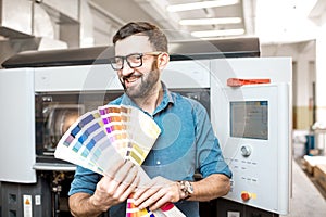 Typographer with color swatches at the manufacturing