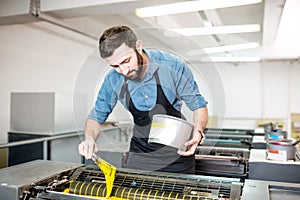 Typographer with paint at the manufacturing