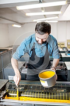 Typographer with paint at the manufacturing