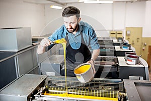 Typographer with paint at the manufacturing