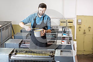 Typographer with paint at the manufacturing