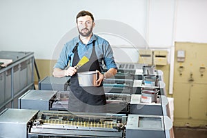 Typographer with paint at the manufacturing