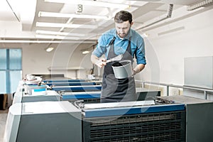 Typographer with paint at the manufacturing