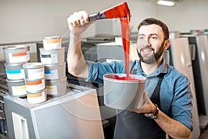 Typographer with paint at the manufacturing