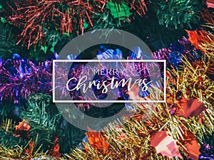 Typographical Merry Christmas Banner. Colorful Christmas background with Christmas prop decoration on Christmas tree
