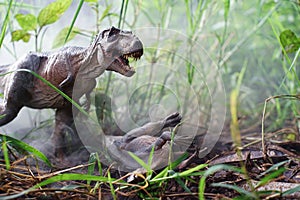 Tyrannosaurus rex dinosaurs is fighting Iguanodon in a misty forest