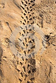 Tyre marks of a vehicle creating pattern on sand