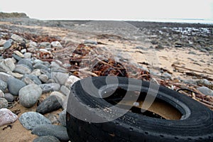 Tyre polluting beach