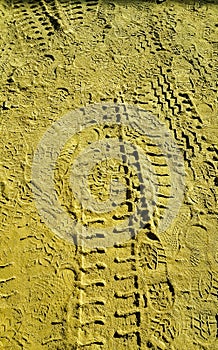 Tyre and Shoes Impression in Sand