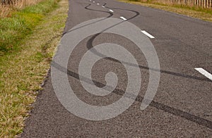 Tyre skid marks on rural road, Gisborne, New Zealand photo