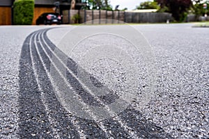 Tyre track on asphalt from hard braking.