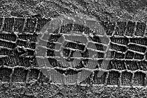 Tyre tracks on sand.