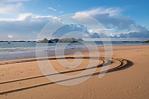 Tyre tracks at Tauranga Bay, Northland, NZ photo