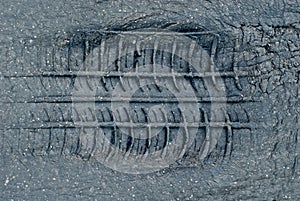 Tyre tread imprint in asphalt