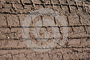 Tyre or wheel track on dirt sand or mud soil background