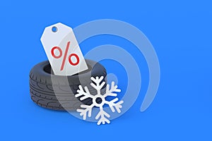 Tyres near snowflake and label with percent symbol. Special offer