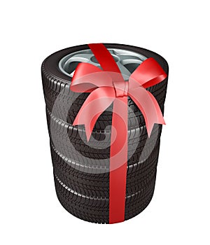 The tyres are stacked and packaged as a gift, wrapped red ribbon