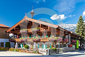 Tyrolean house in front of Wilder Kaiser mountains