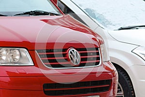 Tyumen, Russia-January 25, 2024: Winter Touch on Parked logo Volkswagen. Red car