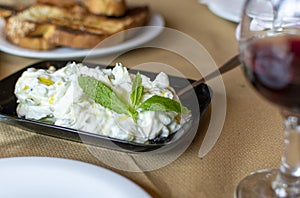 Tzatziki, cacik or tarator,  dip or sauce from Southeast Europe and Middle East made of salted strained yogurt mixed with