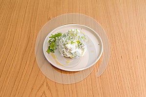 Tzatziki, the Greek version of cacÃÂ±k, is a cucumber and yogurt-based photo