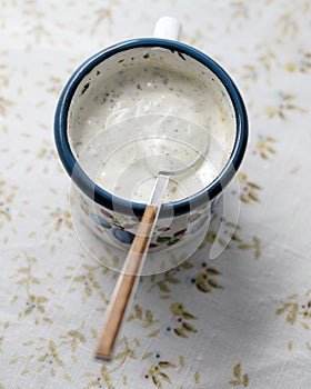 Tzatziki ingredients in a mug