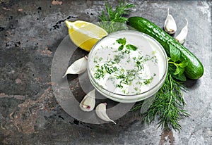 Tzatziki sauce cucumber garlic dill Food background