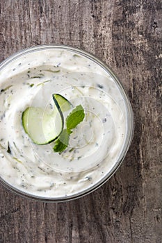 Tzatziki sauce on a rustic wooden table