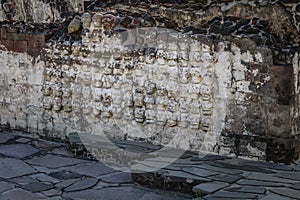 Tzompantli altar with carved Skulls rows in Aztec Temple Templo Mayor at ruins of Tenochtitlan - Mexico City, Mexico