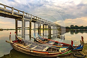 U Bein Bridge, boat trip server at Peaceful lake landscape in Mandalay, Myanmar