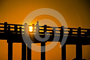 U Bein bridge and people at sunset