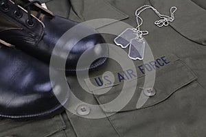 U.S. AIR FORCE Branch Tape with dog tags and boots on olive green uniform photo