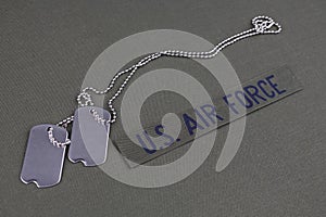 U.S. AIR FORCE Branch Tape with dog tags on olive green uniform