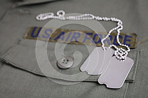 U.S. AIR FORCE Branch Tape with dog tags on olive green uniform