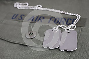 U.S. AIR FORCE Branch Tape with dog tags on olive green uniform