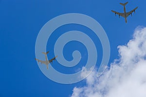 This U.S. Air Force military transport cargo flying high in the sky at high speeds.