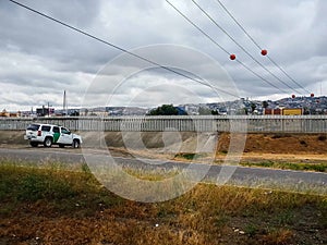 U.S. Border Patrol vehicle parked by fence dividing San Ysidro-Tijuana