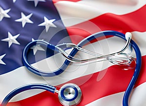 U.S. health care. Medical stethoscope on a U.S. flag. US health insurance concept