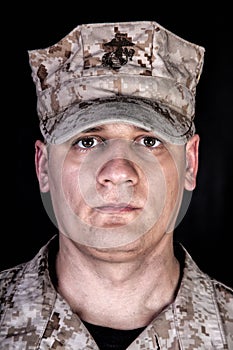 U.S. Marine in patrol cap studio portrait on black