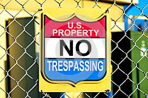 U.S. Property No Trespassing sign on fence