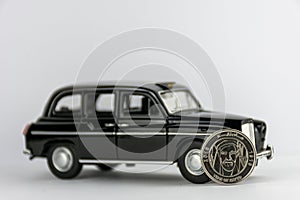 UAE 1 dirham coin on black car.