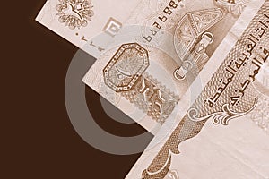 UAE dirham currency background. Brown color toned