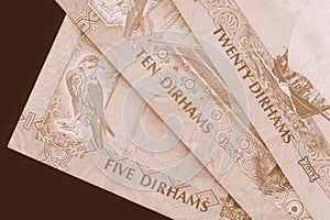 UAE dirham currency background. Brown color toned