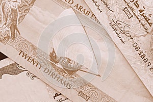 UAE dirham currency background. Brown color toned