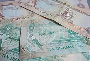 UAE dirham currency notes and coins.