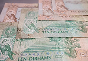 UAE dirham currency notes and coins.