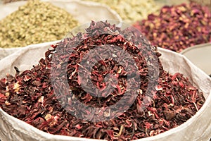 UAE, Dubai, Dry red hibiscus tea leaves and other spices for sale in the spice souq in Deira.