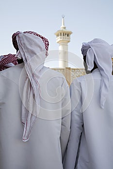 UAE Dubai group of traditionally dressed Muslim men perform a song for visitors to the Bastakia photo